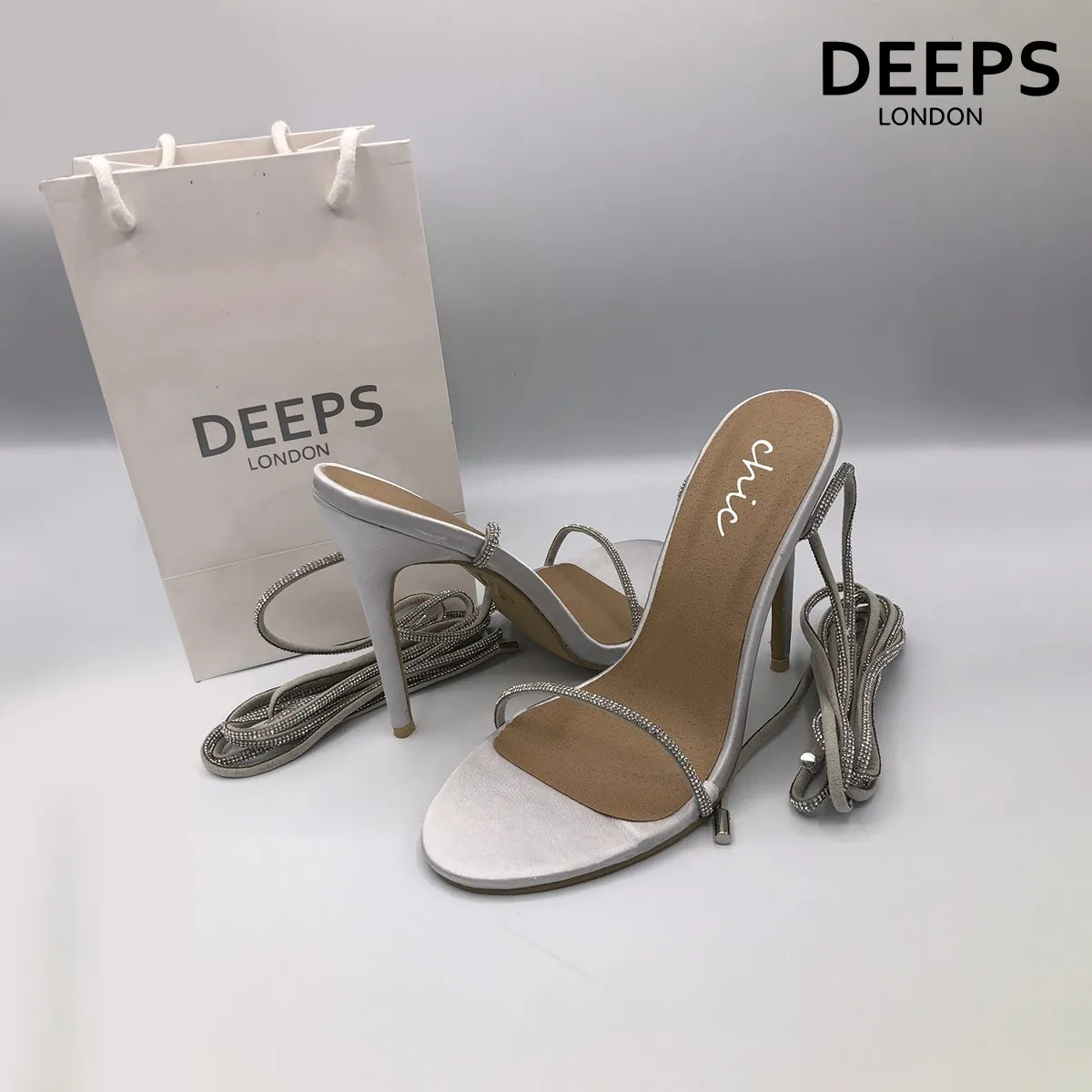 NOMI SATIN RHINESTONE LACE-UP HEELS SILVER